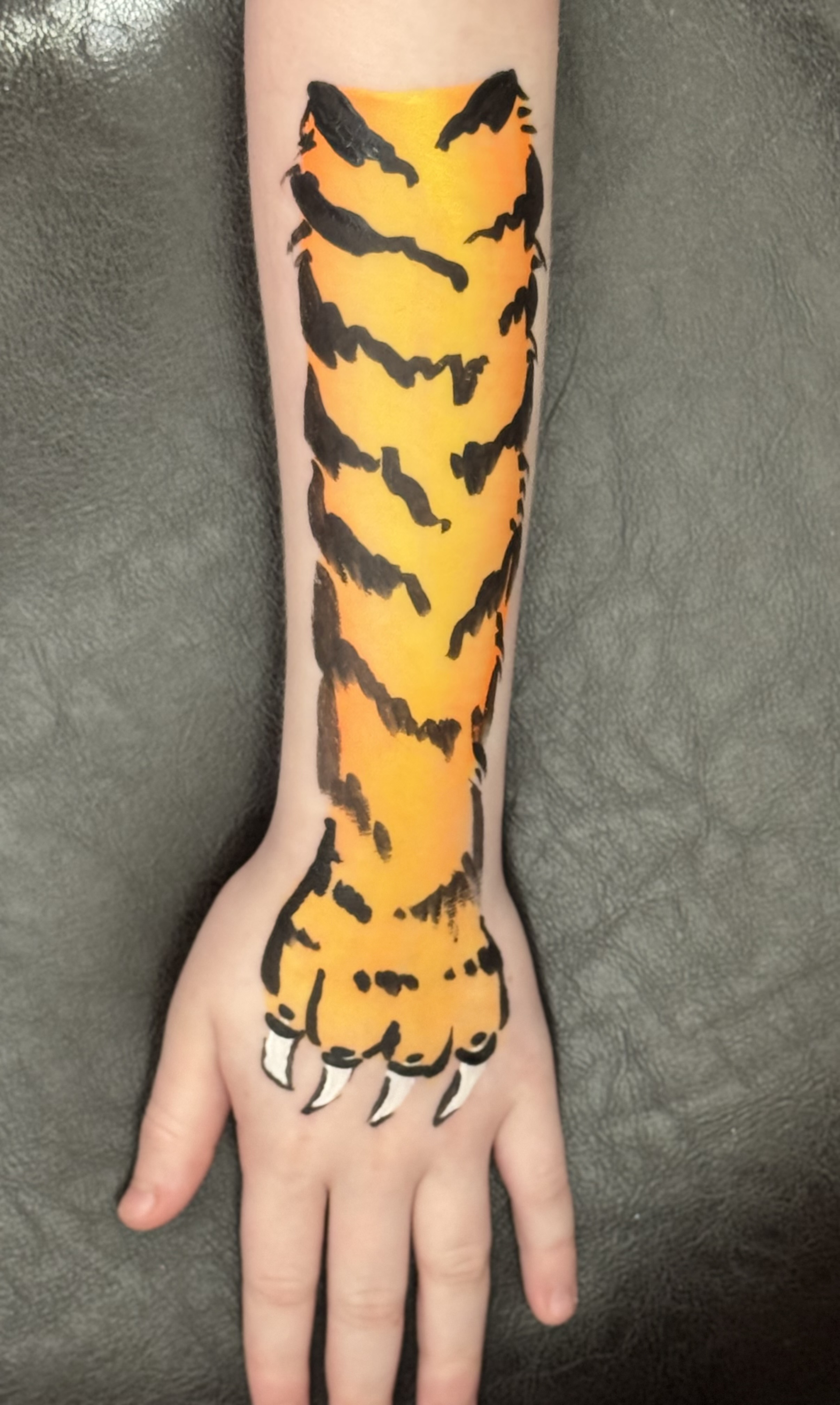 Face painting example: Tiger Arm Art